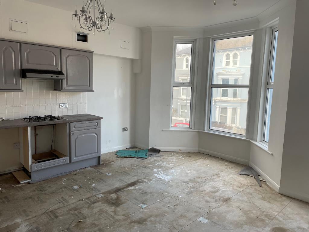 Lot: 8 - TWO-BEDROOM FLAT IN NEED OF UPDATING - View of living room with open plan kitchen